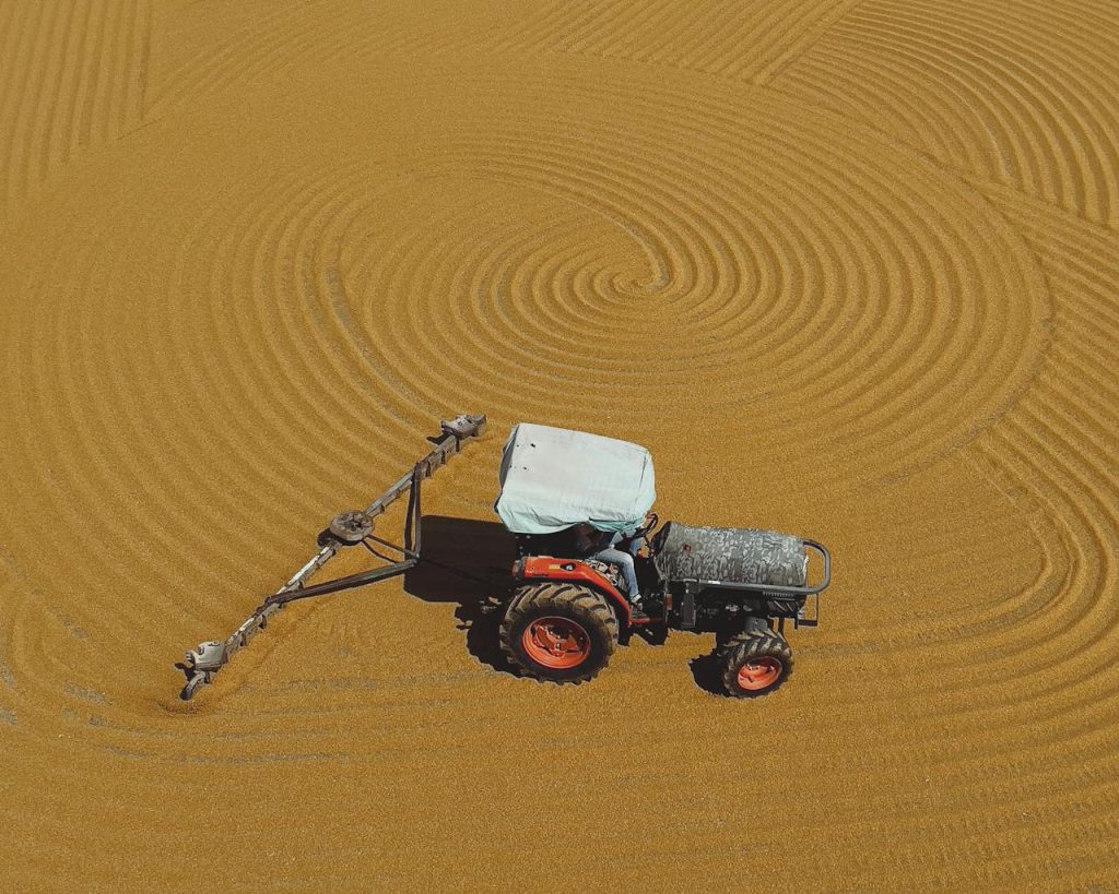 pexels-photo-19819164 Drone Shot of a Tractor Driving on a Field